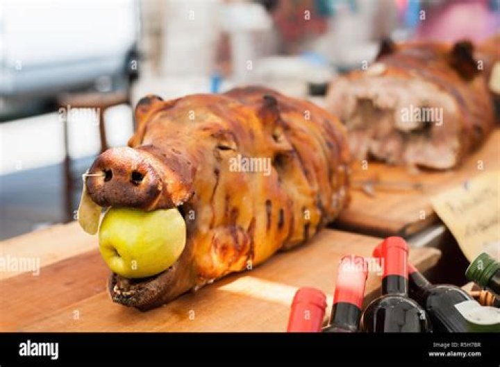 Pig With Apple In Mouth